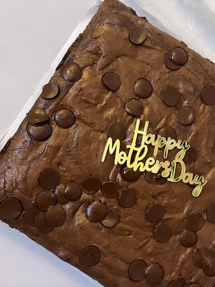 A simple yet heartfelt gift for Mother's Day: a slab of my classic fudgy brownie with a "Happy Mother's Day" topper.