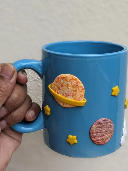 Mugs that spark imagination. This space-themed mug features planets and stars, perfect for a child who loves astronomy.