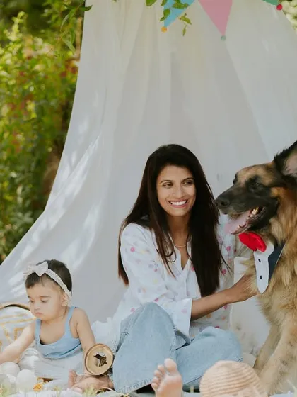 A girl, her mom, and her best furry friend. Including pets in family photos makes them even more special.