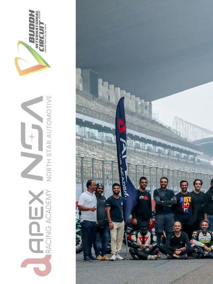 Another shot of our riders posing with the Apex banner at the Buddh International Circuit, a track fit for MotoGP.