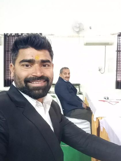 A moment from the referee's table during a weightlifting competition. My focus is always on upholding the standards of the sport and ensuring fair play for every athlete.