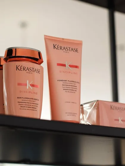 A shelfie of the Kérastase Discipline range, our go-to solution for taming frizz and achieving smooth, manageable hair.