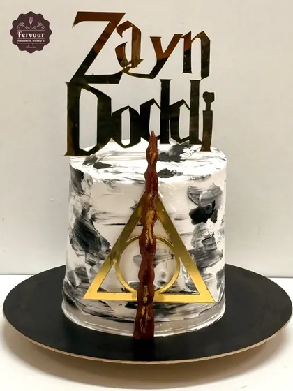 Even my own son wanted a simple cake for his 12th birthday. I made him this no-fuss Red Velvet cake with a Harry Potter theme, featuring the Deathly Hallows symbol and a wand.