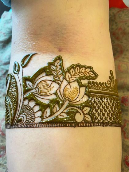 A collection of designs with fresh henna paste, showing the clean lines and 3D effect before the paste dries and falls off.