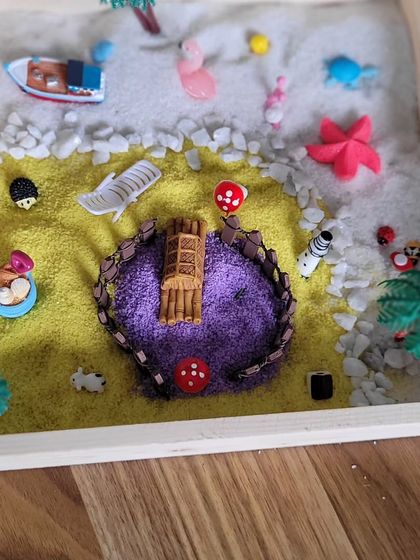 A close-up of a finished Zen garden, showing the careful placement of each tiny element. This activity is not just about art; it's about learning to create a space of calm and intention.