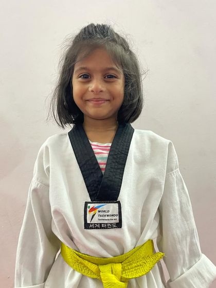 A proud champion from our academy. Her medal is proof that with dedication, anyone can achieve their goals.