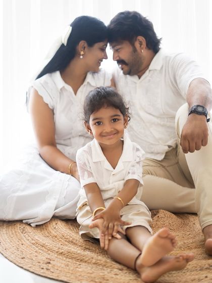 A duplicate of a beautiful family portrait, emphasizing the loving gaze between the parents.