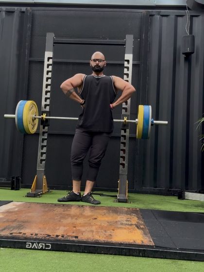A classic lat spread pose. Building a wide back is a long term project that requires thousands of reps of heavy rows and pull ups.