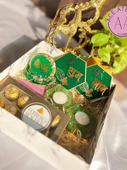 Another view of the elegant green Diwali hamper. The combination of deep green resin with gold accents creates a luxurious feel, making it an ideal gift for corporate clients or loved ones.