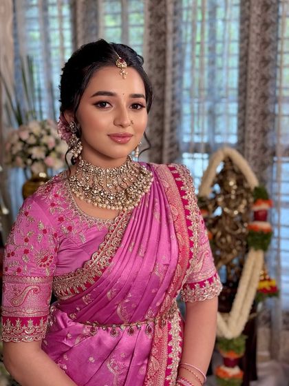 A beautiful portrait capturing the client's serene expression in her traditional attire.