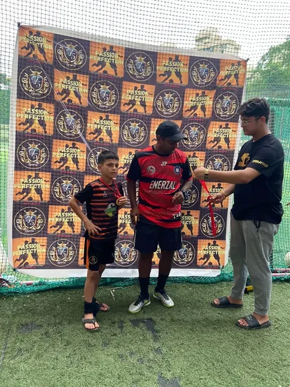 A player being awarded for his performance in the tournament.