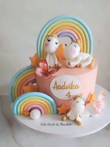 An absolutely stunning unicorn cake I created for a 4th birthday. Every single element, from the three adorable unicorns to the pastel rainbows and delicate butterflies, was handcrafted with love.