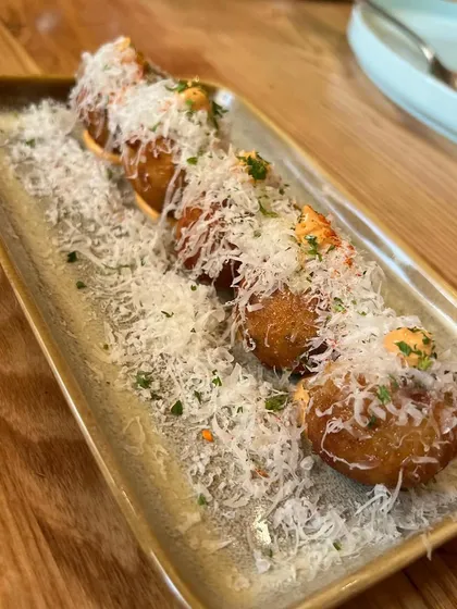 These incredible potato tots covered in parmesan cheese from a restaurant in Mumbai were so inspiring. I'm always on the lookout for new textures and flavours to incorporate into my menus.