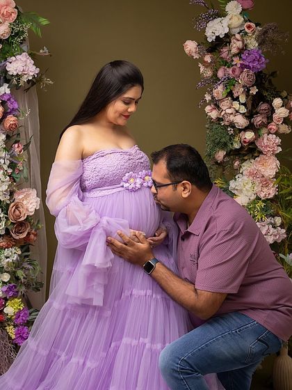 A gentle kiss for the baby bump. These are the simple, heartfelt gestures that I aim to capture during a couple's maternity session.
