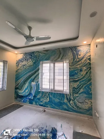 An example of a modern abstract wallpaper installation in a bedroom. The blue and gold marble-like pattern creates a dramatic and sophisticated accent wall, and I ensure the lines flow perfectly around corners.
