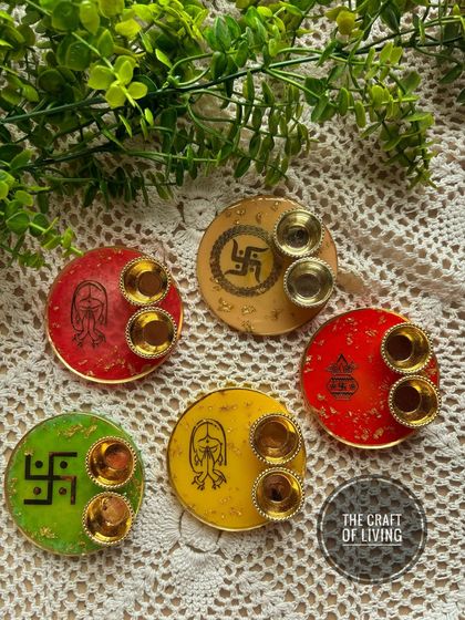 A colorful collection of mini puja thalis. Each one is handcrafted with unique designs and sacred symbols, perfect for festive gifting or personal use.