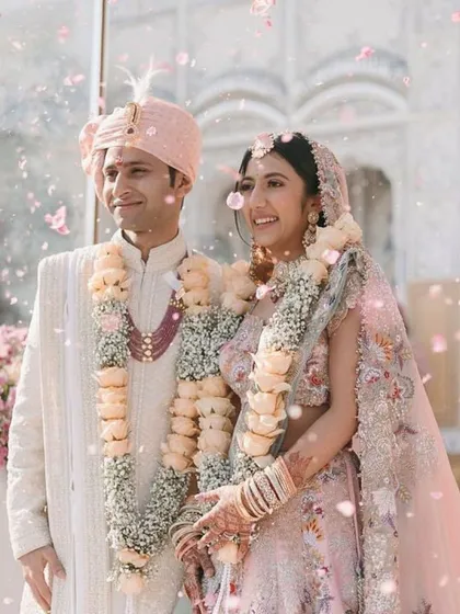 A surreal moment from a dream wedding, with petals showering the happy couple. I work to curate these magical experiences, ensuring your big day is filled with moments of beauty and wonder.