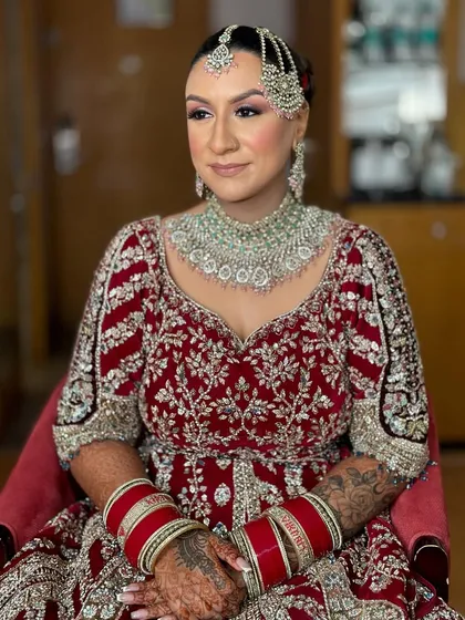 Kerry's complete look, showcasing the balance between her detailed outfit, statement jewelry, and the polished makeup. A perfect modern bridal style.