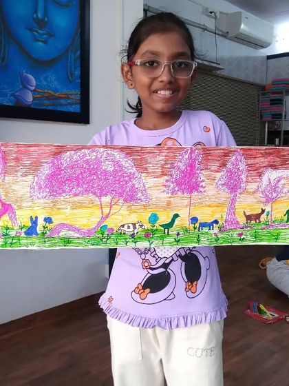 Jivika from 3rd standard created this lovely evening jungle scene. She used sketch pens to create a beautiful pink-hued sky and populate the landscape with various wild animals.