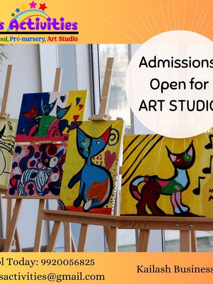 A gallery of our students' pop art cat paintings on easels. This image showcases the fun and colorful results of our guided painting sessions, where each child creates their own unique version of the subject.