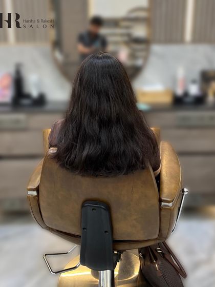 The "before" shot of a global color service. The client's hair is ready for a single-process color to create a uniform and polished look.