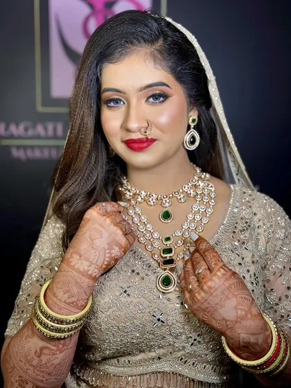 A regal Muslim bride look featuring a stunning multi-layered Polki and emerald necklace. This jewellery set is available for rent and is perfect for creating a royal and elegant bridal statement.