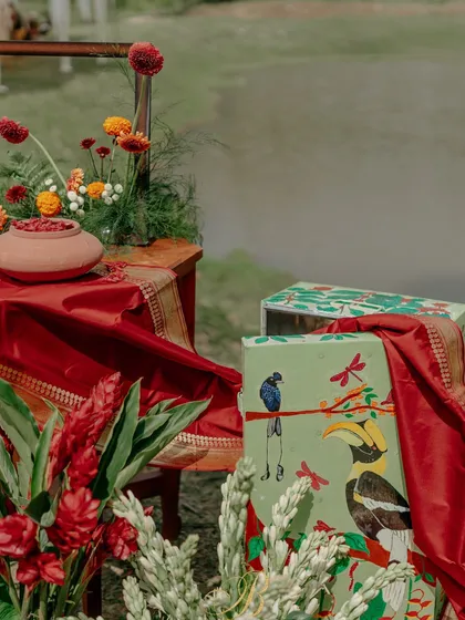 A hand-painted trunk by a local artist, showcasing the flora and fauna of Coorg, serves as a key element in this installation. It's a celebration of local talent and the region's natural beauty.