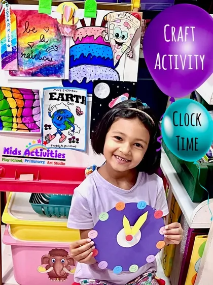 Look at this proud smile. This student just finished making her own clock during a craft activity. We focus on hands-on projects that are not only fun but also teach practical concepts in an engaging way.