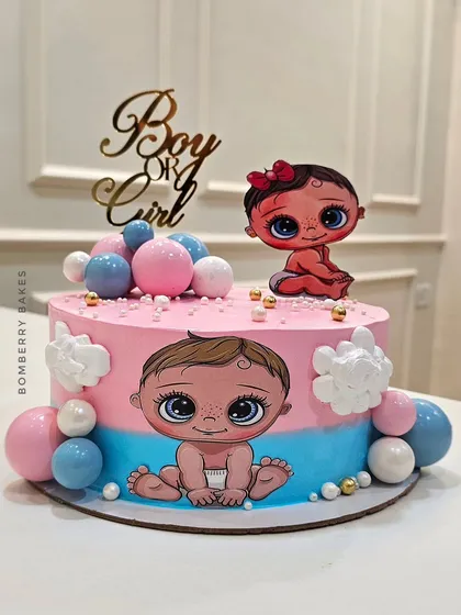 Another creative gender reveal cake, using a split pink and blue design and adorable illustrated babies.
