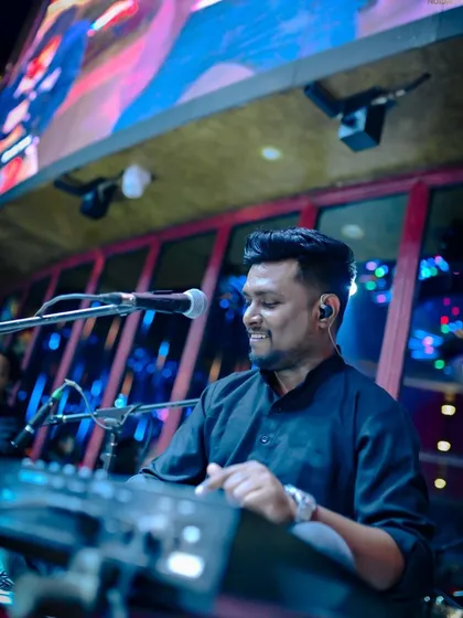The maestro on the keys. Our keyboardist is a versatile musician who can create atmospheric pads for a ghazal or play energetic chords for a Bollywood hit.