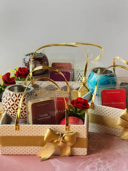 A collection of custom gift baskets ready to be sent out. Each one is thoughtfully curated with a wax warmer, wax melts, and a jar candle, perfect for spreading warmth and creating cherished memories among friends.