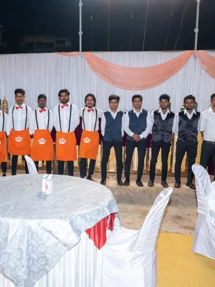 My team is my strength. Here is a part of my professional, uniformed staff ready for service at a large wedding, ensuring everything runs smoothly for you and your guests.