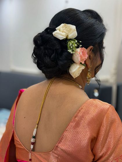 A slightly different angle of the classic rose bun, showing the texture and volume.