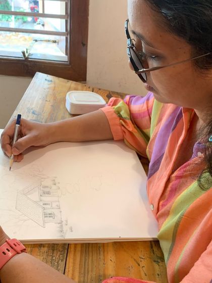 A Sunday still from our studio, capturing a student deep in thought and focus as she works on her architectural sketch.