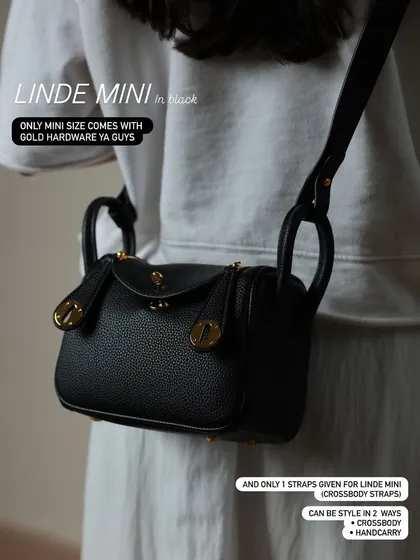 A detailed look at the Linde Mini in black. This shot highlights the beautiful gold hardware, which is exclusive to the mini size, and shows how it can be styled as a crossbody or handbag.