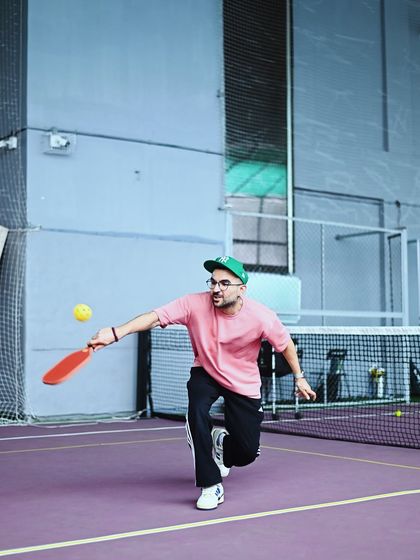 A player in action during a pickleball game, demonstrating the quick reflexes needed for the sport.