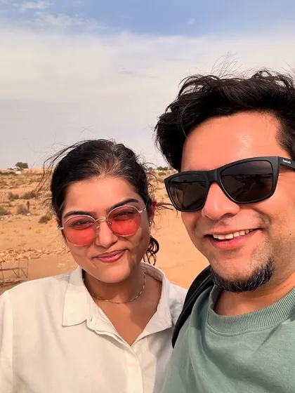 Dhruvi and Johaan taking a moment to enjoy the view before a desert gig. We love exploring the beautiful locations our music takes us to.