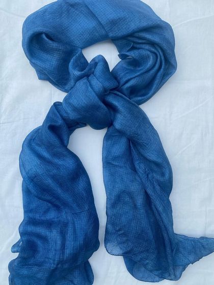 The full Kota silk stole, dyed with natural indigo. It's a versatile piece that can be styled in many ways, adding a touch of handmade elegance to any outfit.