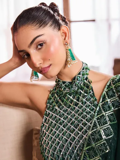 A beauty shot highlighting the green beaded halter top. I used a soft pink lip and a hint of blush to complement the green tones in the outfit and earrings.