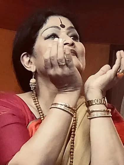 Using hand gestures, or mudras, to explain a concept from a Sanskrit text during my 'RASA SUTRA' presentation.
