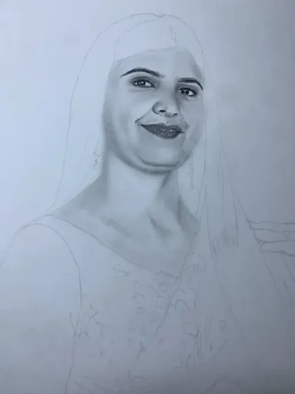 A work-in-progress shot where the face is partially shaded, showing the contrast between the initial outline and the finished sections.