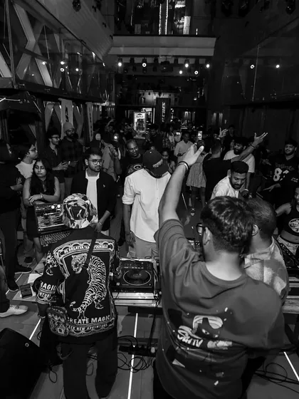 A black and white shot of the party from my perspective. The crowd was packed in, and the energy was flowing all night long.