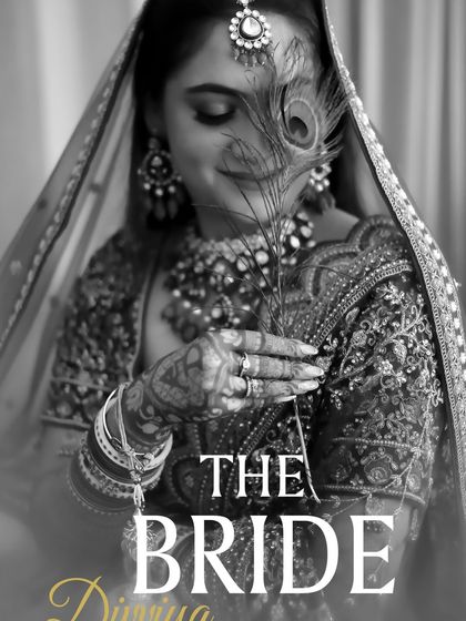 A classic and graceful black and white bridal portrait. The peacock feather adds a touch of traditional symbolism and artistry, making the photo unique and deeply personal.