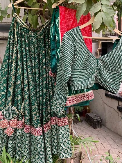 The lehenga, blouse, and dupatta hanging together, a perfect trio.