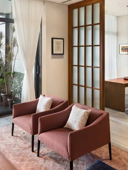 Fluted glass sliding doors separate the study from the main living area, allowing for privacy without sacrificing light. The design demonstrates how we create flexible, multi-functional spaces within an open-plan home.