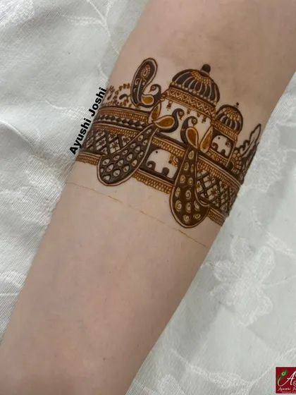 The initial outline for the royal bridal armband, showing the placement of the palace, peacocks, and elephants.