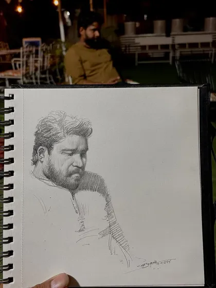 Here is the finished live sketch alongside the subject. It's always rewarding to create a piece of art on the spot and share that moment with the person I'm drawing.