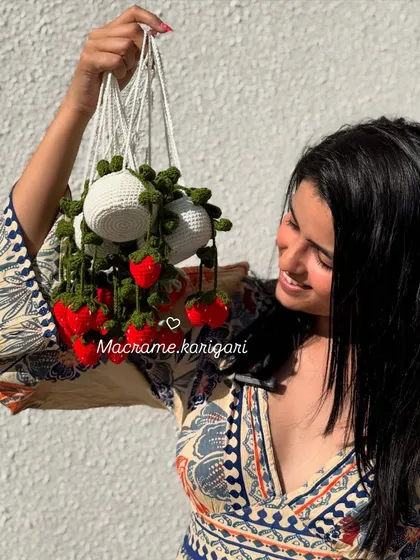 Our hanging strawberry pot charm, featuring bright red strawberries and a white pot. It's a sweet and whimsical accessory for your car or home.