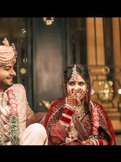 A candid shot of the bride's reaction during the joota churai rasam, a moment of pure fun.