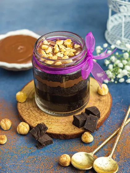 This Nutella jar cake is one of my most-loved items. Layers of chocolate cake and creamy Nutella, topped with crunchy hazelnuts.